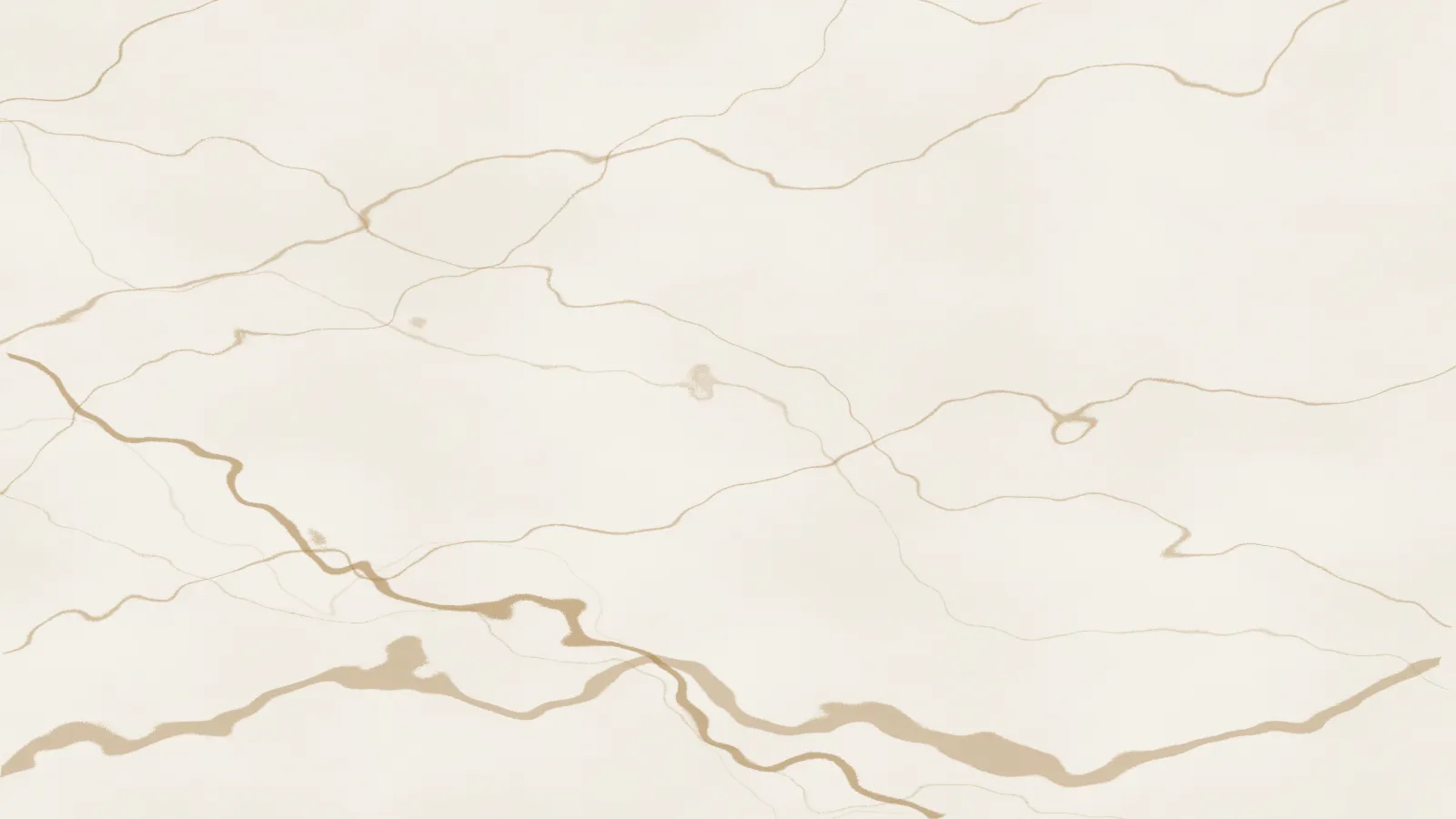 A pale marble surface with warm veining
