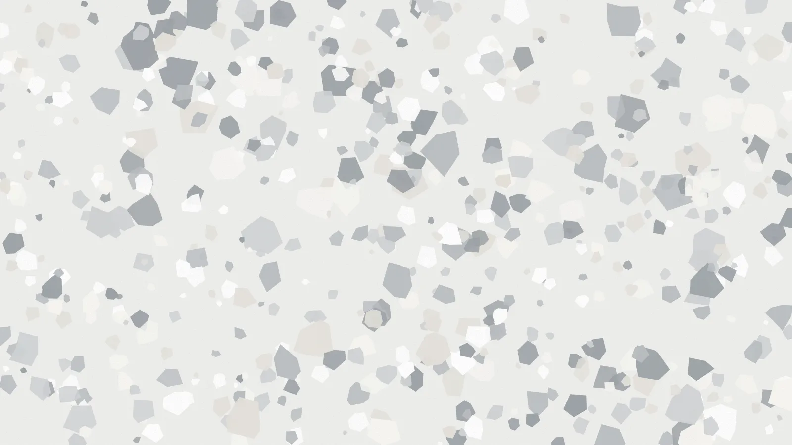 A pale terrazzo surface with white and grey chips