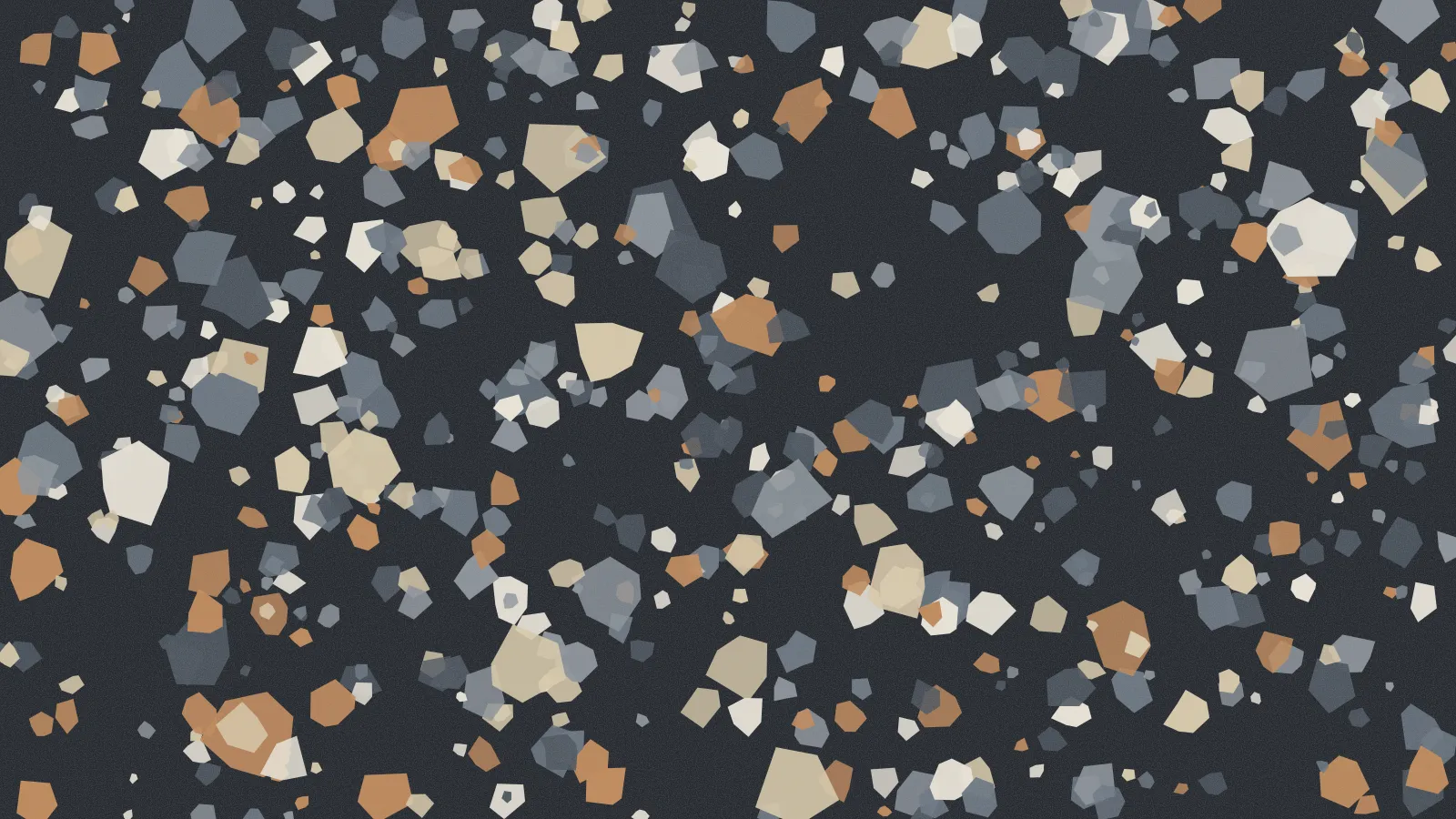 A dark terrazzo surface with pale and copper chips