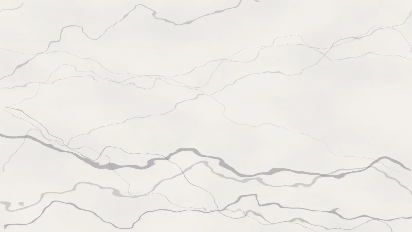 A white marble-look surface with grey veining